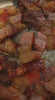 Guanciale cooking and sizzling in a pan